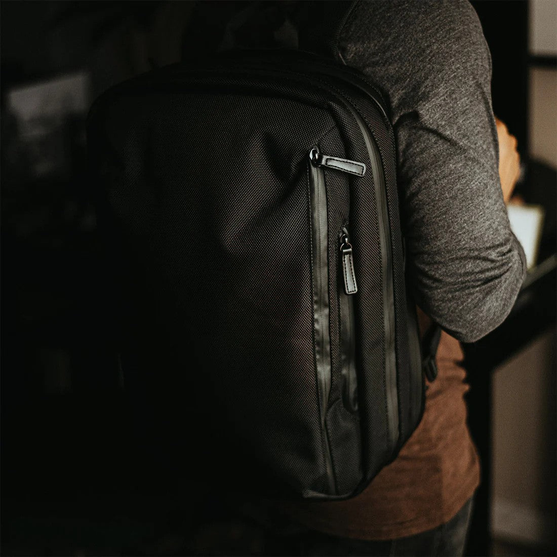 Versatile Black Commuter Bag On a mans back. 