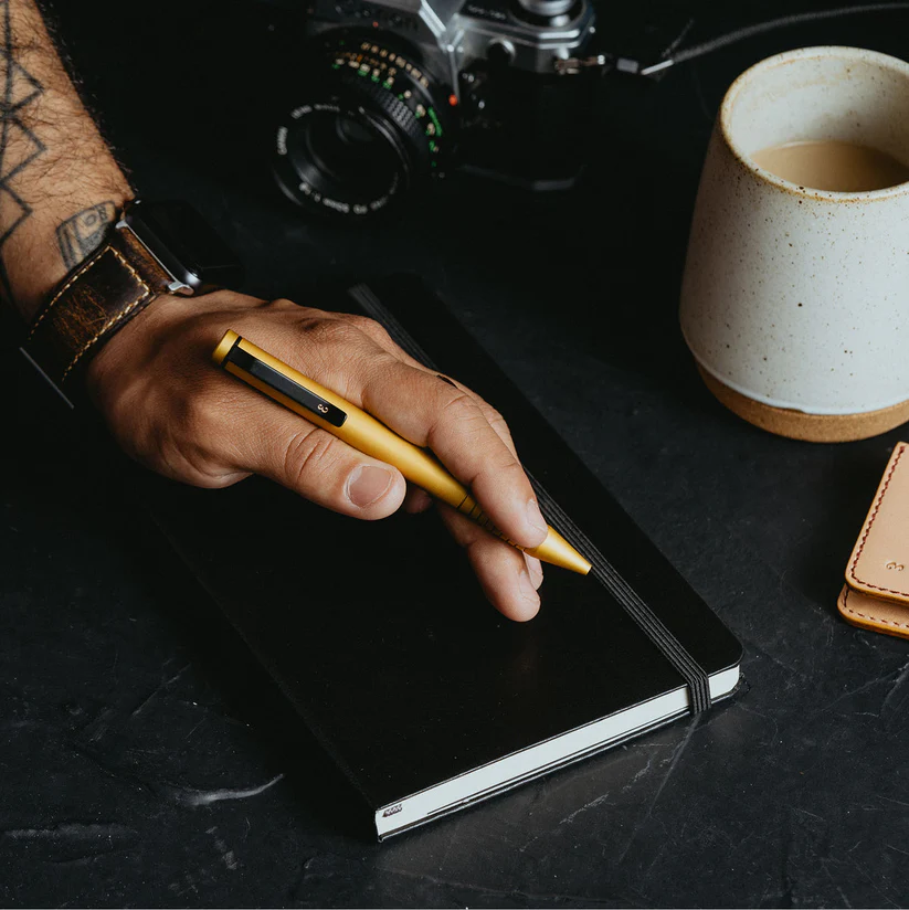  Everyday Items including a grafton pen and a notebook. 