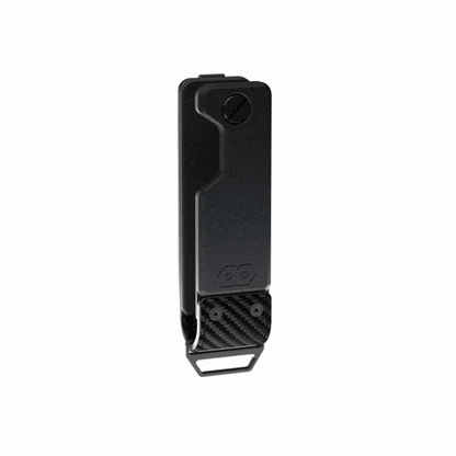 Animated view of the closed PROOF Oracle key holder on white, turning to show the carbon fiber panel and the drop-down steel loop