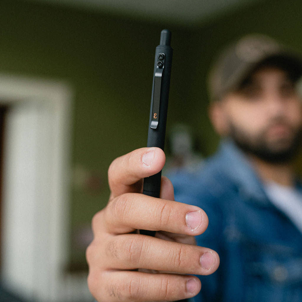 Person holding a black Grafton Pen from Everyman