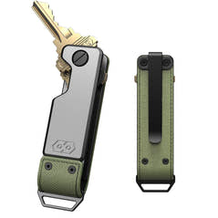 PROOF Operator key holder front and back: satin aluminum body with brass keys fanned from the pivot, and an olive drab ballistic nylon back panel with pocket clip and steel loop