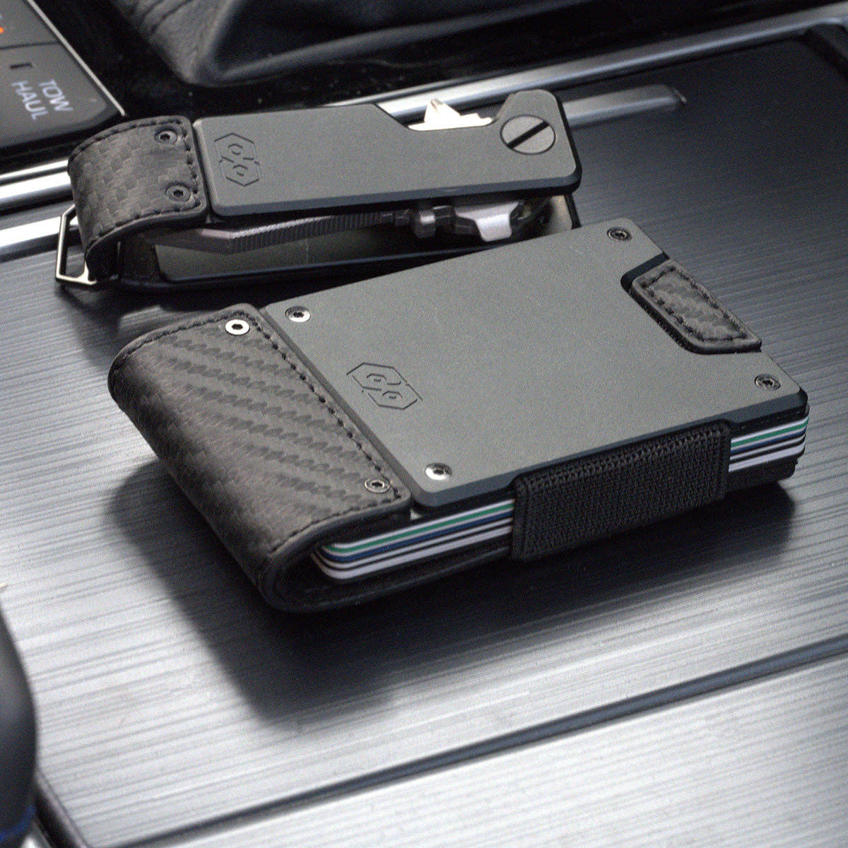 PROOF Oracle carbon fiber wallet beside the matching PROOF Oracle key holder