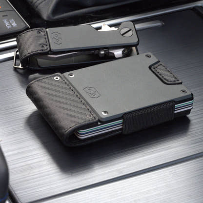 PROOF Oracle carbon fiber wallet beside the matching PROOF Oracle key holder